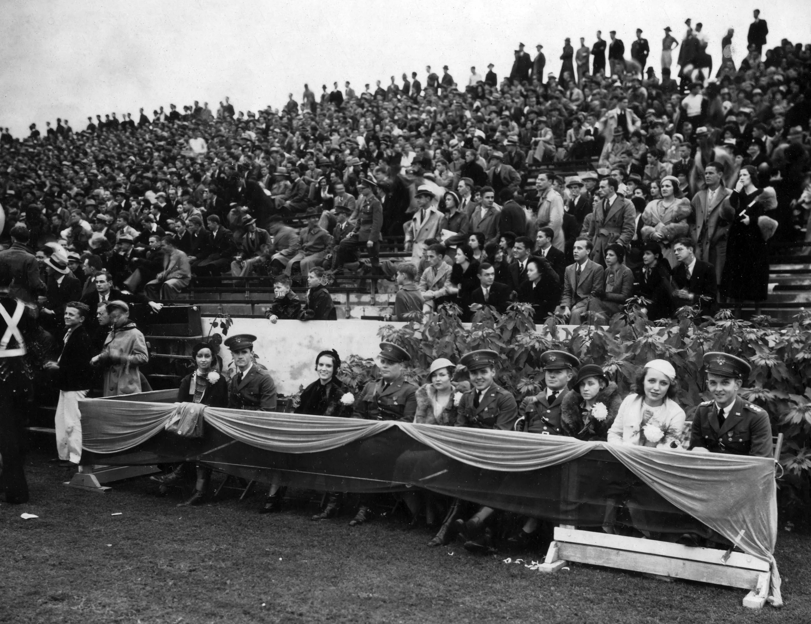 Women in the Homecoming Court and their ROTC escorts during 1930 homecoming game against Alabama