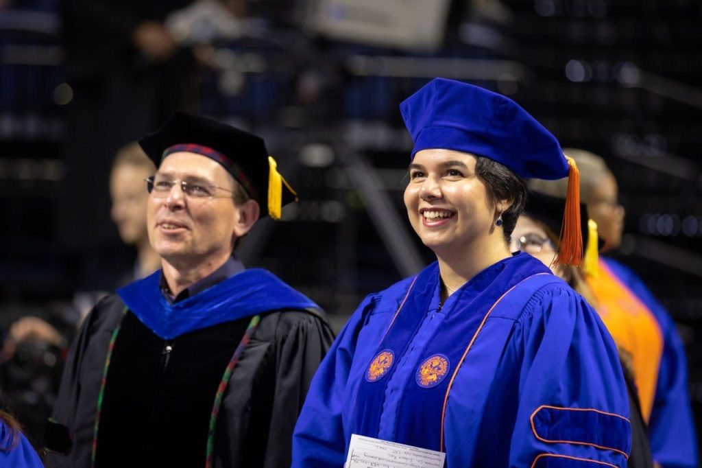 Students and professor at graduation