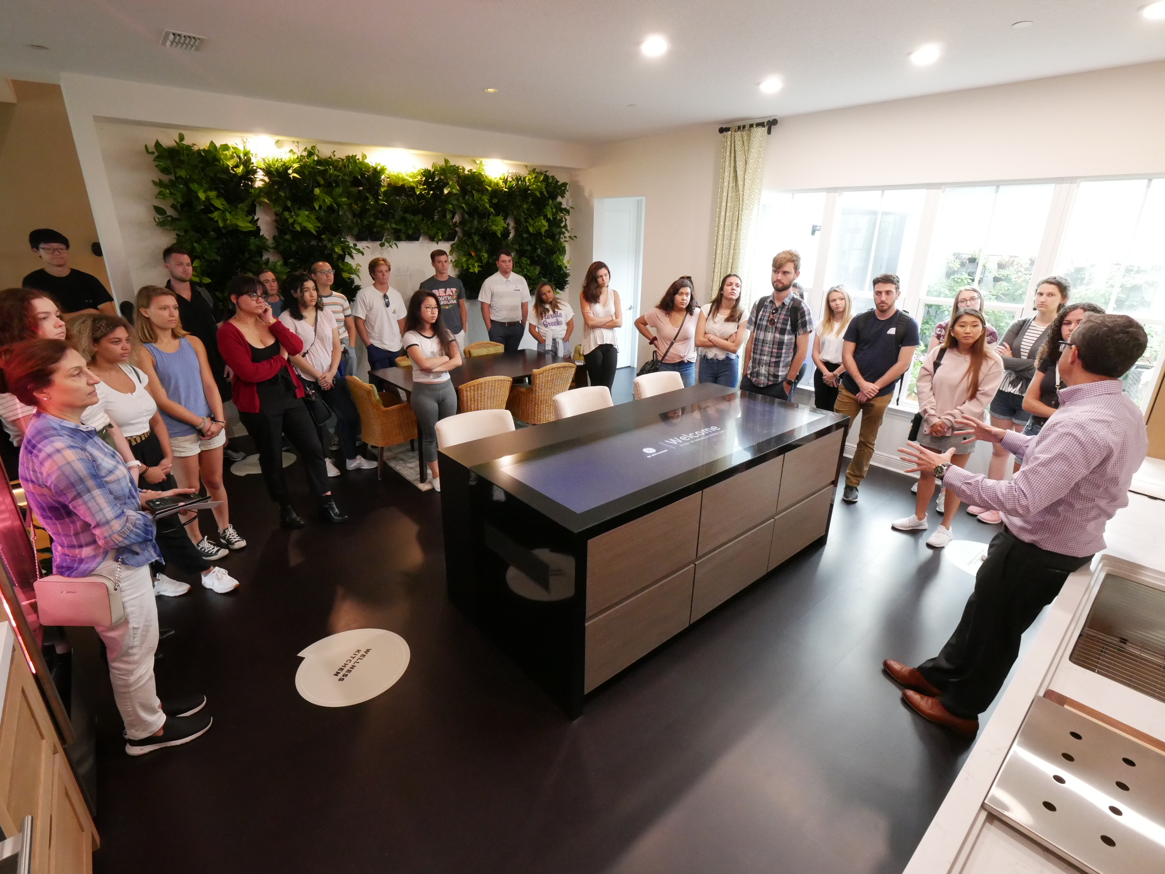 SBE students get a tour of a smart home kitchen.