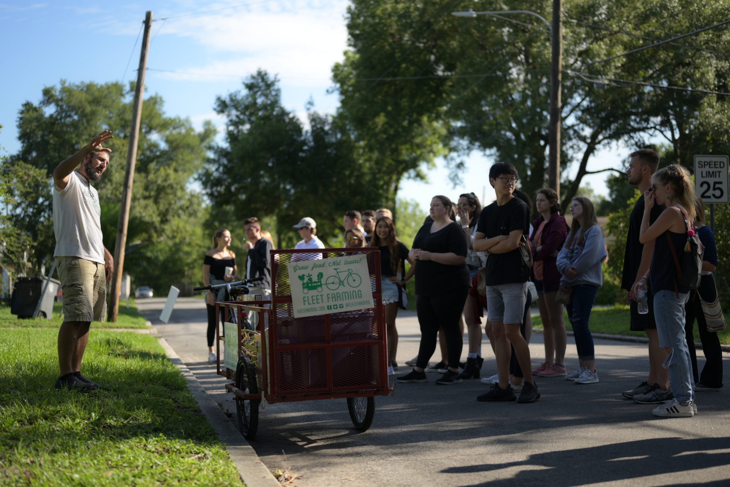SBE students get a tour of the Fleet Farming front yard gardening project.