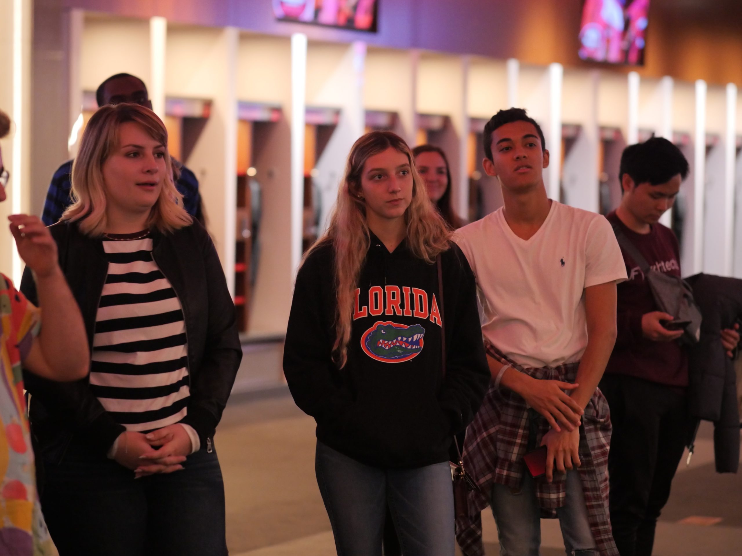 SBE students stand in the football locker room at Mercedes Benz Stadium in Atlanta, GA.