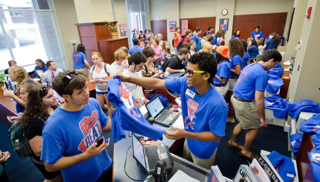 Students giving away t-shirts.