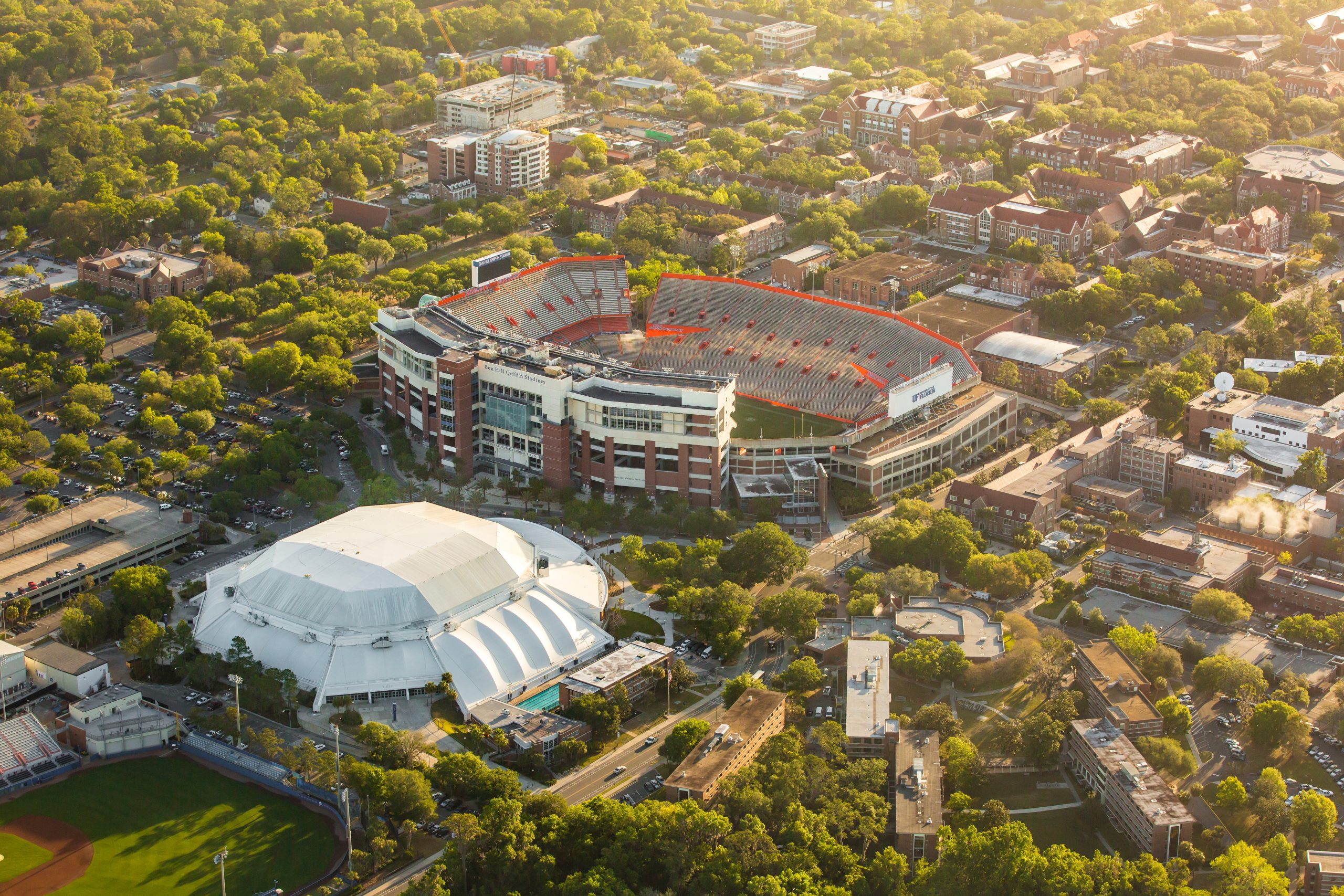 Aerial photo of Exactech Arena and Ben Hill Griffin Stadium at UF.