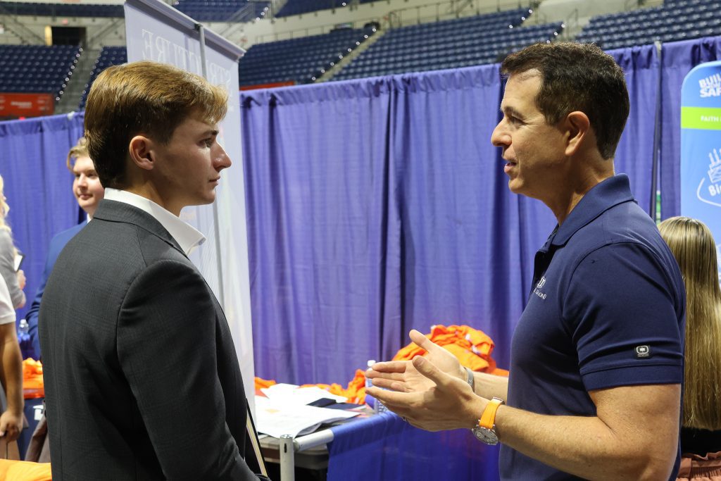 Student speaking with gator alum and possible employer