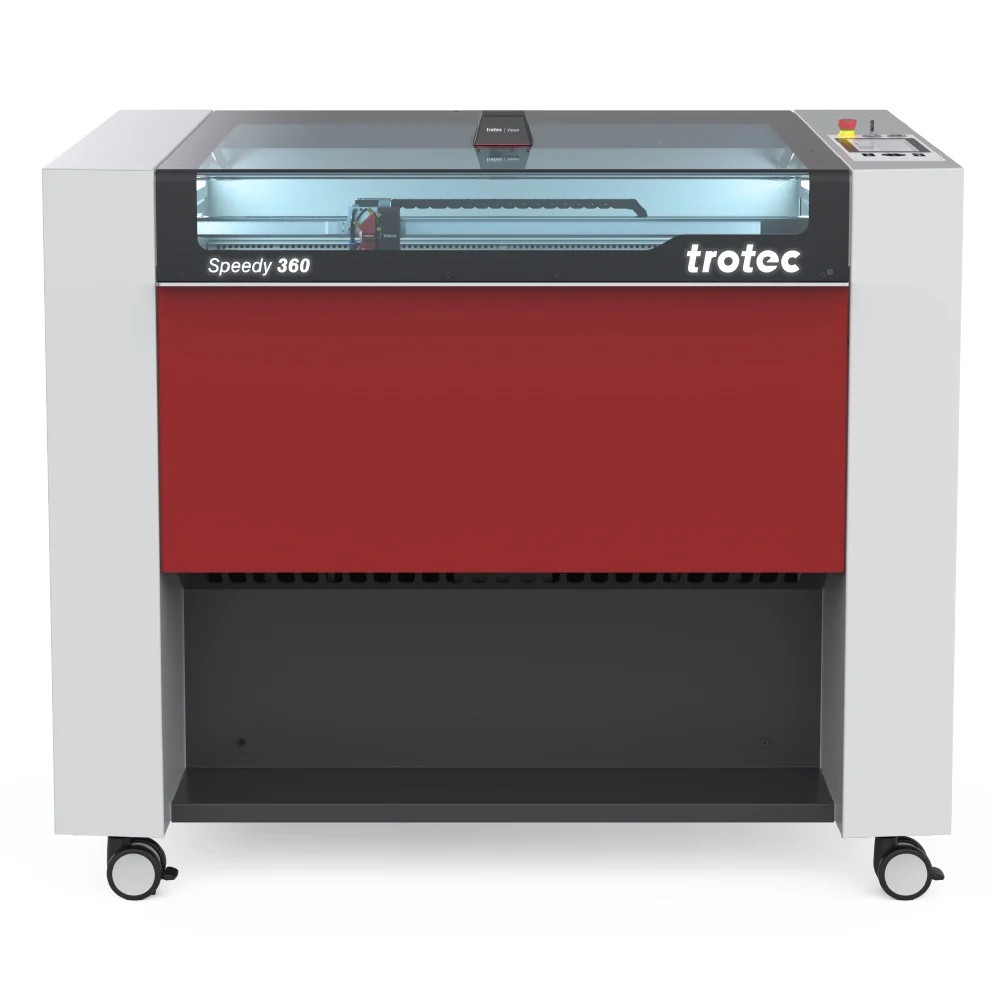 A Trotec Speedy 360 laser engraving machine with a red front panel, transparent top lid, and control buttons on the top right. The machine is on wheels for mobility.